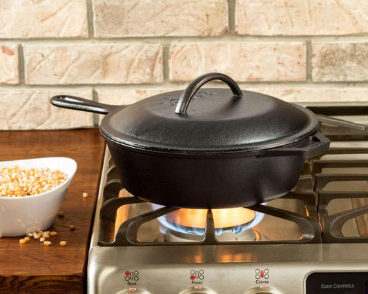 Versatile pre-seasoned 2-in-1 cast iron combo cooker on stove, ideal for searing, sautéing, broiling, and frying, classic black